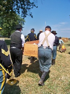 Friends carry their fellow soldier to his resting place